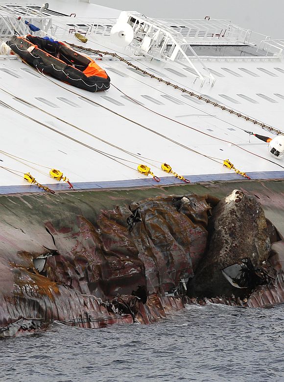 Holes are seen on Costa Concordia cruise ship that ran aground off the west coast of Italy