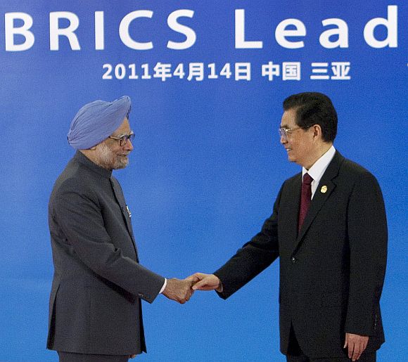 PM Singh is greeted by China's President Hu Jintao during the BRICS Leaders Meeting in Sanya, China in April, 2011