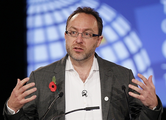 Wikipedia founder Jimmy Wales gestures during the opening session at the London Cyberspace Conference in London