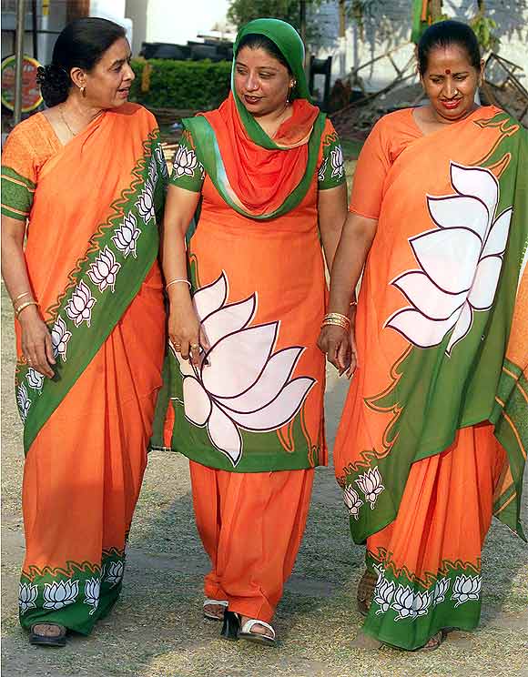 BJP activists bear the party symbol
