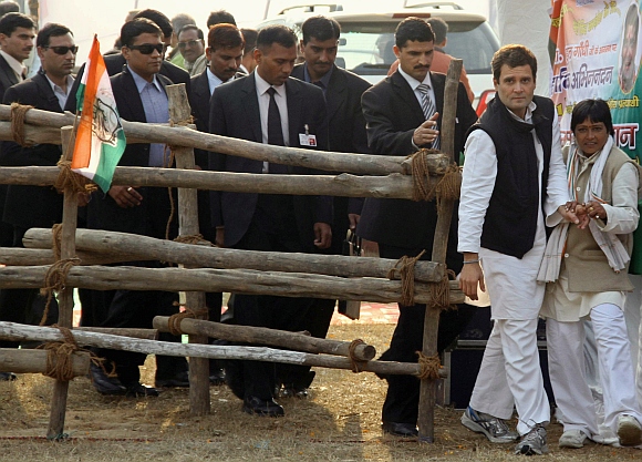 Rahul Gandhi walks ahead of the members of Special Protection Group during an election campaign rally at Gorakhpur