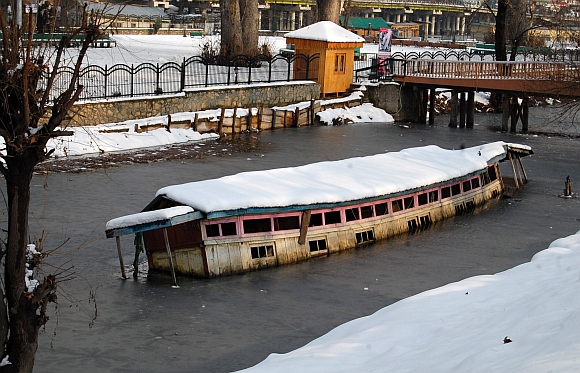 A houseboat submerged in the river Jhelum after a heavy snowfall