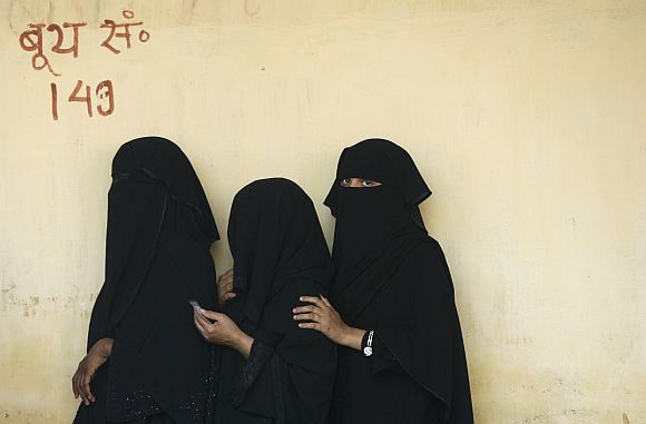 Muslim women wait to vote in Varanasi during the 2009 general election