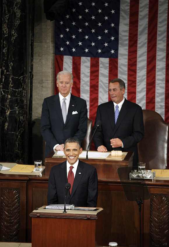Obama delivers his State of the Union address to a joint session of Congress as Vice President Joe Biden and House Speaker John Boehner listen