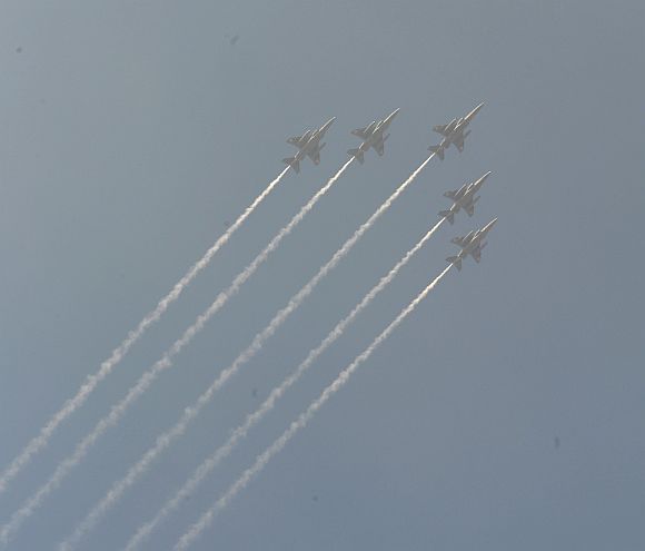 IAF fighter jets in formation fly over Rajpath