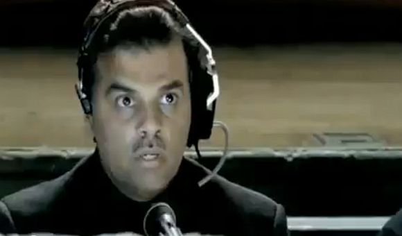 A grab from the controversial Stupidisco music video shows Mansoor Ijaz as a commentator for a women's wrestling bout