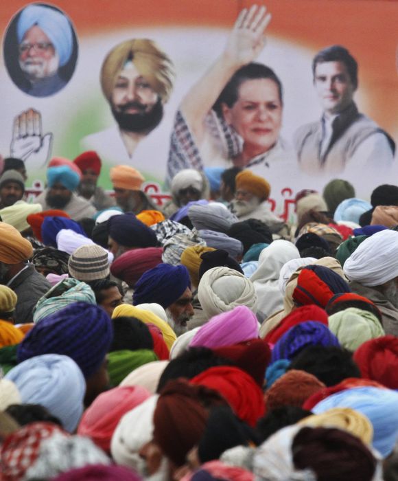 People attend an election campaign rally at Moga in Punjab