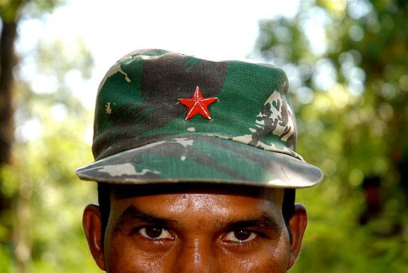 A Naxal fighter at remote camp in Bastar