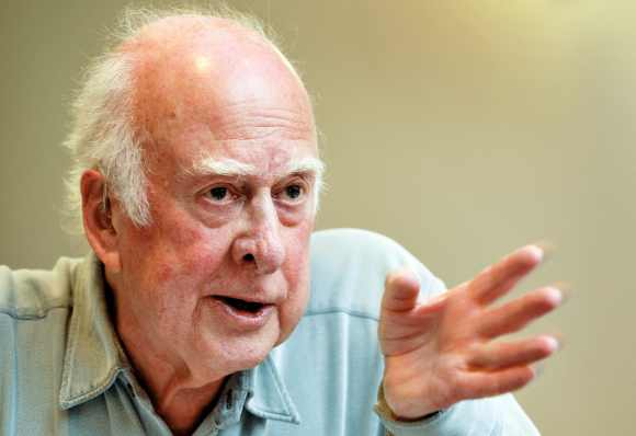 British physicist Peter Higgs gestures during a press conference at CERN