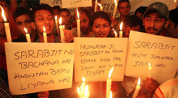 Students take part in a candle-light march for Sarabjit