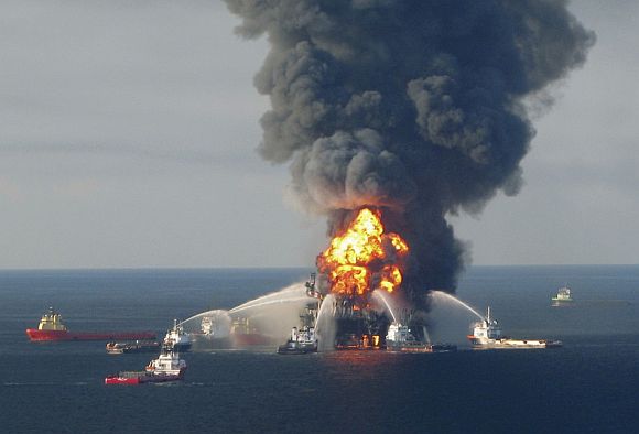 Fire boat response crews battle the blazing remnants of the offshore oil rig Deepwater Horizon, off Louisiana, in this April 21, 2010 file handout image