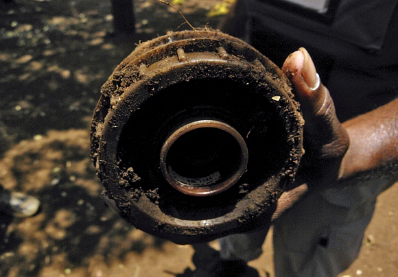 A de-miner shows anti-personnel landmine laid by separatist Tamil Tigers in Sri Lanka