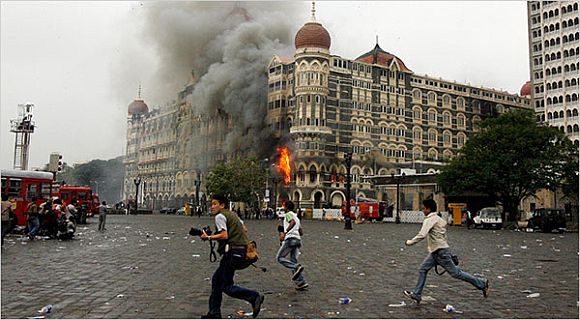 Flames and smoke pour from Hotel Taj Mahal in Mumbai during the 26/11 attacks