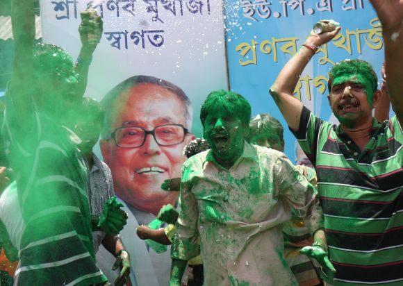 Supporters of Pranab Mukherjee celebrate on the streets of Kolkata on Sunday