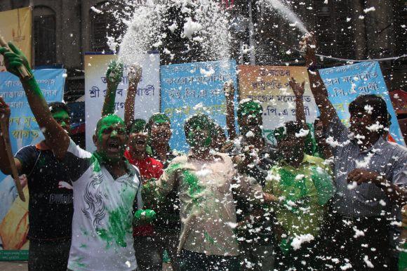 Supporters of Pranab Mukherjee celebrate on Kolkata streets on Sunday