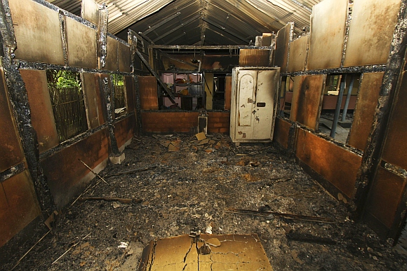 An interior view of a house that was burnt during ethnic riots is seen near Goshaigaon town, in Assam