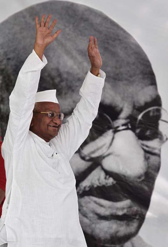 Anna Hazare waves to his supporters in New Delhi
