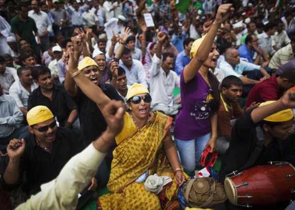 Supporters of Hazare shout slogans as they take part in a protest in New Delhi July 25