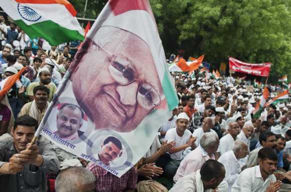 A Hazare supporter A supporter waves a flag during a protest in New Delhi July 25