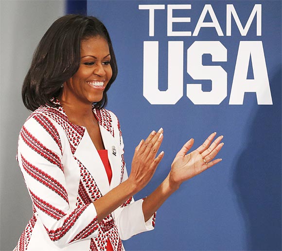 Michelle Obama plays tug of war, football in London