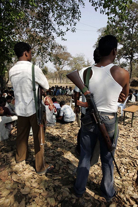 Tribal members of the Salwa Judum movement, a self-defense force of villagers organised to challenge Maoists, gather in Gudma village, about 450km south of Raipur