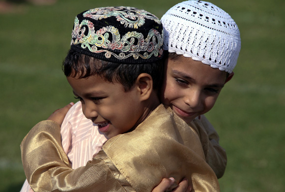 Muslim boys greet each other in Jammu