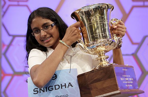 Snigdha Nandipati holds her trophy after winning the Scripps National Spelling Bee at National Harbour in Maryland