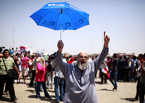 An Egyptian man celebrates after the verdict on Mubarak
