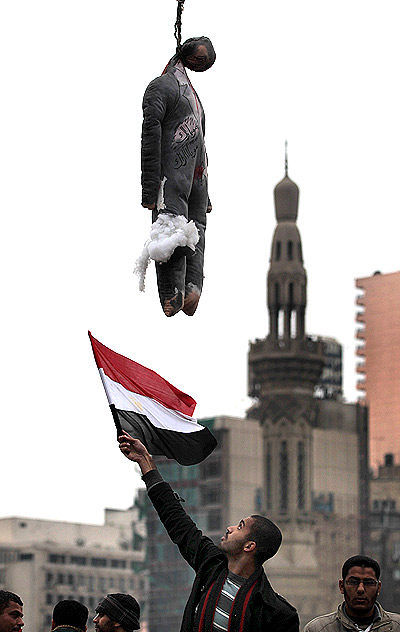 n effigy of Egyptian President Hosni Mubarak hangs at a traffic intersection in Tahrir Square