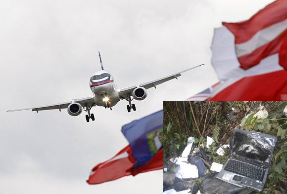 File photo of a Sukhoi Superjet 100. (Inset) Debris and belongings of passengers of the Russian Sukhoi aircraft that crashed on the slopes of Mount Salak are seen at the wreckage site, near Bogor May 11