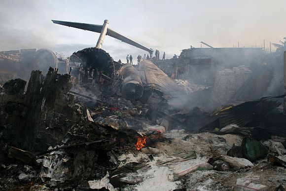 The wreckage of the Hewa Bora Airways passenger jet burns at the crash site in Goma, capital of Democratic Republic of Congo's eastern North Kivu province, April 16, 2008