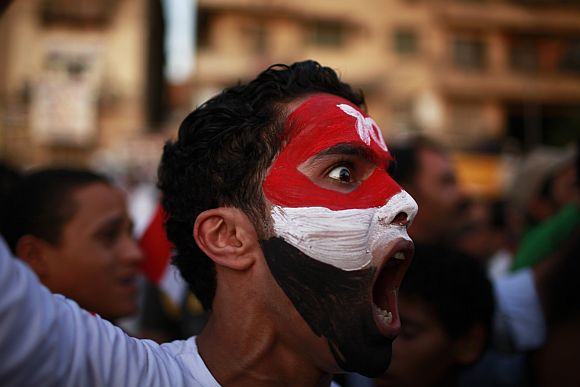 A protester shouts during a demonstration at Tahrir square in Cairo