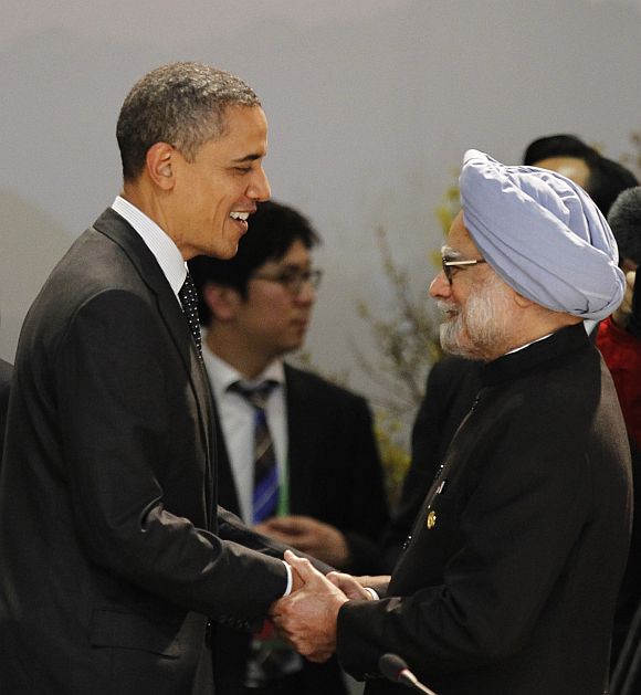 US President Barack Obama shakes hands with Prime Minister Manmohan Singh as they arrive for a working dinner at the Nuclear Security Summit in Seoul