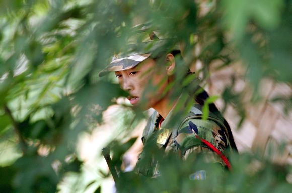 A Naga rebel stands guard at the Hebron Camp in Nagaland