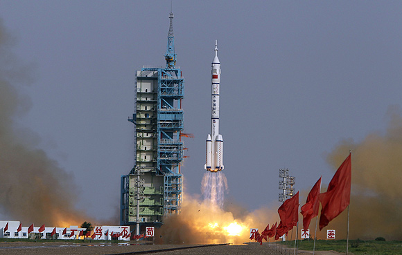 The Long March II-F rocket loaded with a Shenzhou-9 manned spacecraft carrying Chinese astronauts Jing Haipeng, Liu Wang and Liu Yang lifts off from the launch pad in the Jiuquan Satellite Launch Center