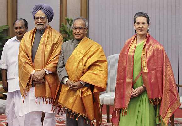 Finance Minister Pranab Mukherjee flanked by Prime Minister Manmohan Singh and Congress president soon after he was named as the UPA's presidential candidate. To the extreme left is Defence Minister AK Antony