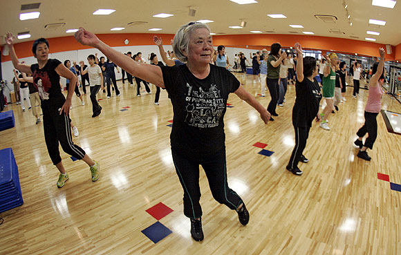 Women take part in an aerobics class at a gym in Tokyo