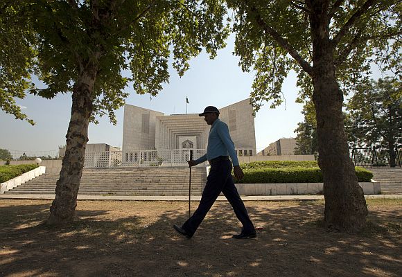 A policeman walks past the supreme court in Islamabad