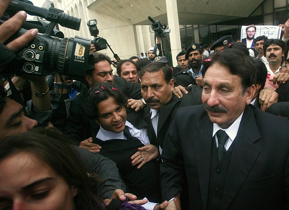 File photo of Supreme Court Chief Justice Iftikhar Chaudhry is surrounded by media and well wishers as he walks toward his offices in Islamabad