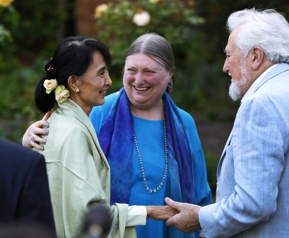 Aung San Suu Kyi speaks with old friends during a reception at Oxford University