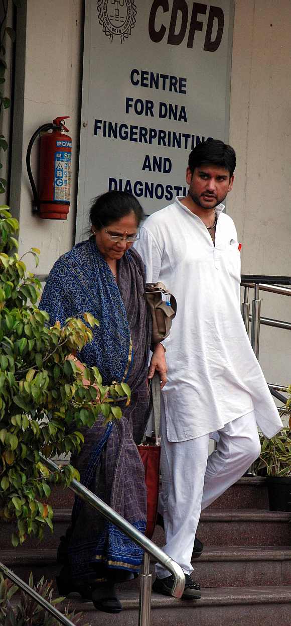 Rohit Shekhar and his mother Ujjawala Sharma exit the centre for DNA fingerprinting and diagnostics laboratory in Hyderabad
