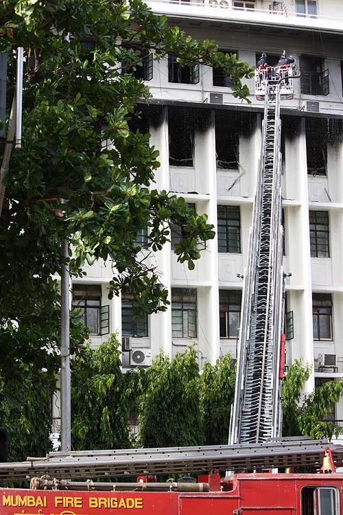 Smoke rises from the Mantralaya offices as firefighters struggle to douse the flames