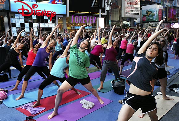 New Yorkers stretch as they practise yoga