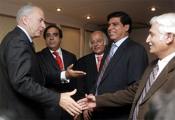 Raja Pervez Ashraf (2nd R) with Don McKinnon at a meeting in Islamabad.