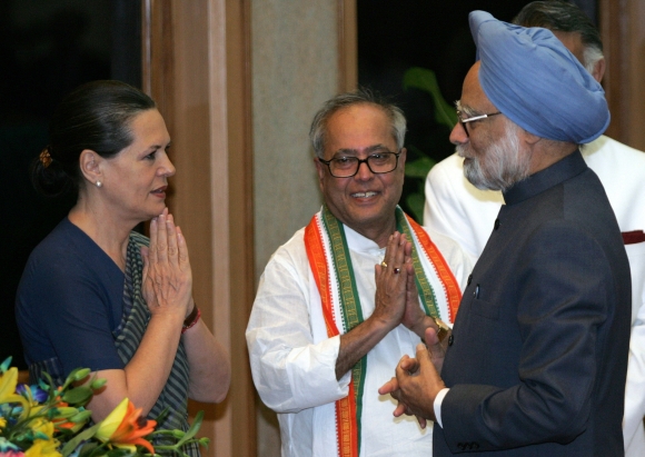 Finance Minister Pranab Mukherjee with Congress chief Sonia Gandhi and Prime Minister Manmohan Singh