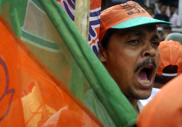 A BJP activist shouts slogans during a protest demonstration