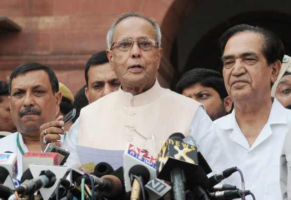 Mukherjee addresses the media after stepping down as finance minister
