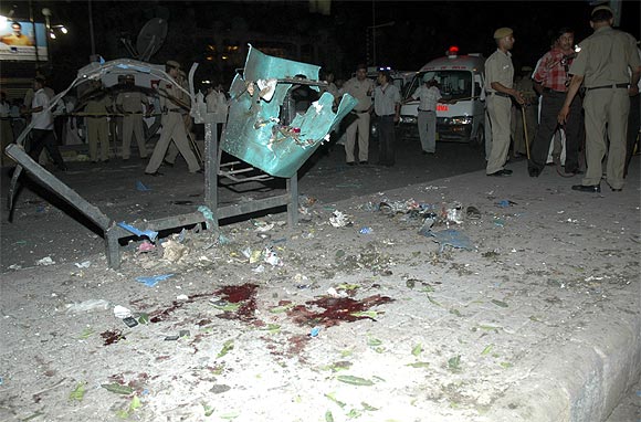 Policemen inspect one of the blast sites in Delhi in September, 2008