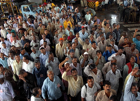 Mill workers protesting at the main arterial road in Bandra, Mumbai