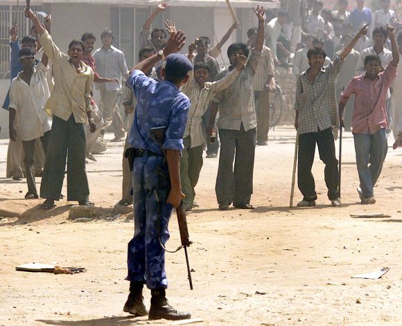 An RAF trooper facing rioters during the post-Godhra riots in 2002
